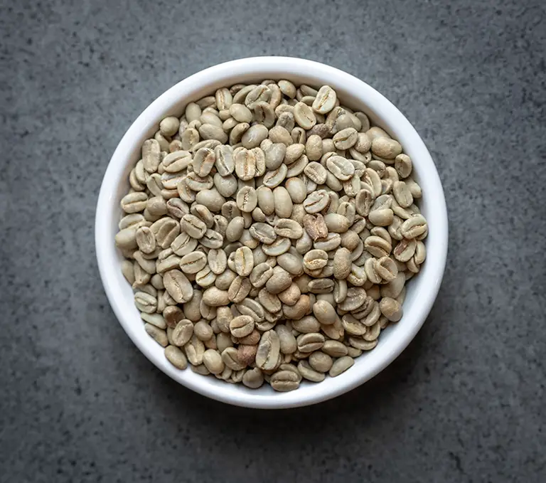 Colombia FTO green coffee beans in a white bowl