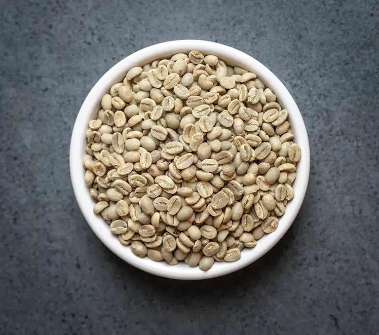 Ethiopia Yirgacheffe Green Coffee Beans Ethiopia Yirgacheffe green coffee beans in a white bowl on a dark surface