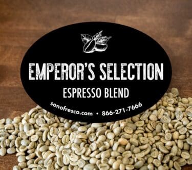 Close-up of dark roasted coffee beans from Sonofresco’s Emperor’s Selection Espresso Blend, showcasing their rich color and smooth texture.