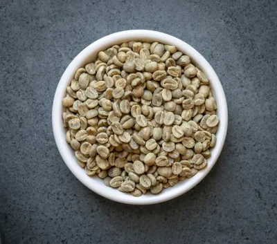 Rwanda organic fair trade green coffee beans in a bowl