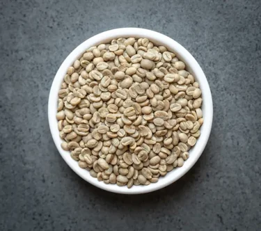 Burundi green coffee beans in a small white bowl