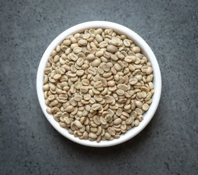 Burundi green coffee beans in a small white bowl